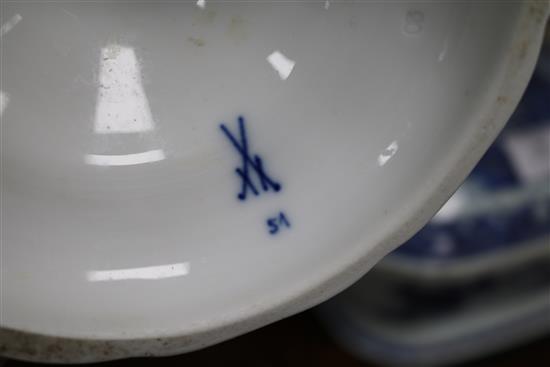 A pair of Meissen onion pattern blue and white candlesticks